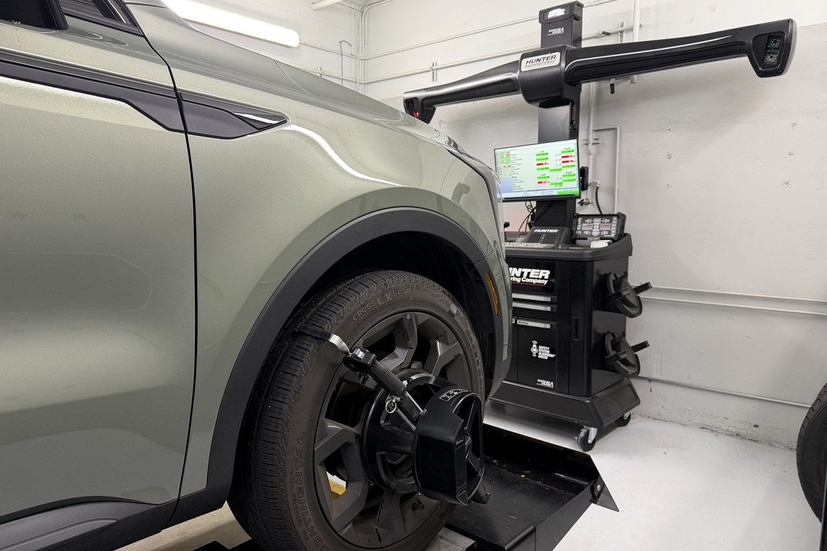 Kia wheel with Hunter alignment target installed at Kia of Portland