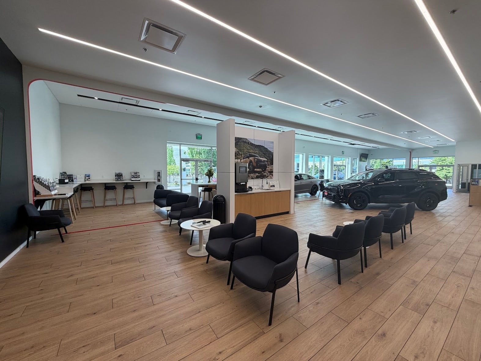 Kia of Portland customer lounge with comfortable seating and Wi-Fi work areas